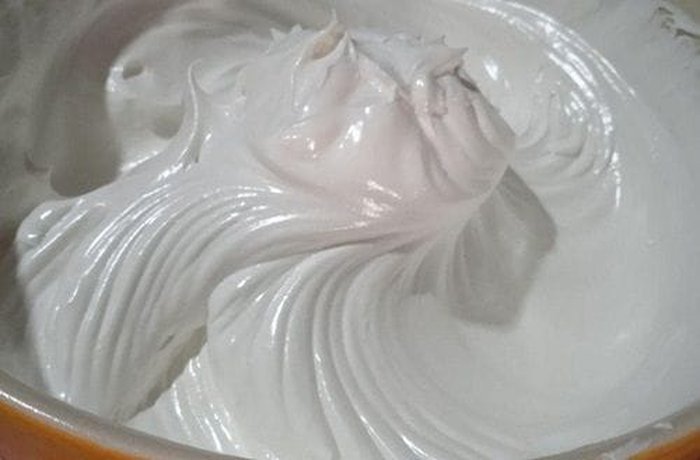 Firm glossy meringue ready to be folded with cream for the cake topping