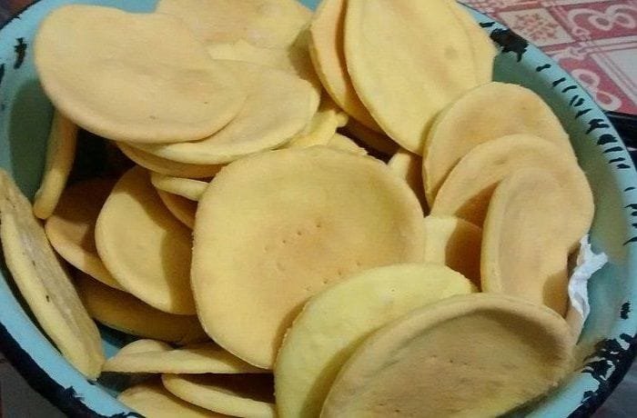 Gluten-free hojarascas baked and stacked, ready to be filled with manjar for alfajores.