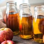 Homemade Chilean apple cider vinegar in glass bottles