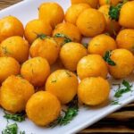 Homemade duchess potatoes, fried mashed potato balls crisp outside and creamy inside