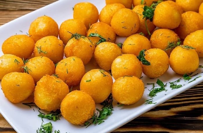 Homemade duchess potatoes, fried mashed potato balls crisp outside and creamy inside