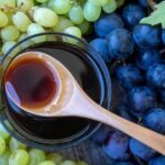 Homemade grape honey, a cooked grape must syrup, in a glass jar