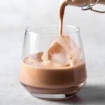 Homemade Irish cream liqueur served over ice in a cocktail glass
