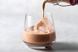 Homemade Irish cream liqueur served over ice in a cocktail glass