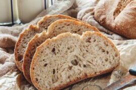 Rustic homemade sourdough loaf with a golden scored crust