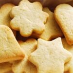 Freshly baked homemade vanilla cookies cut into shapes