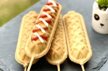 Homemade yoguis or waffle dogs on sticks served with ketchup and mustard
