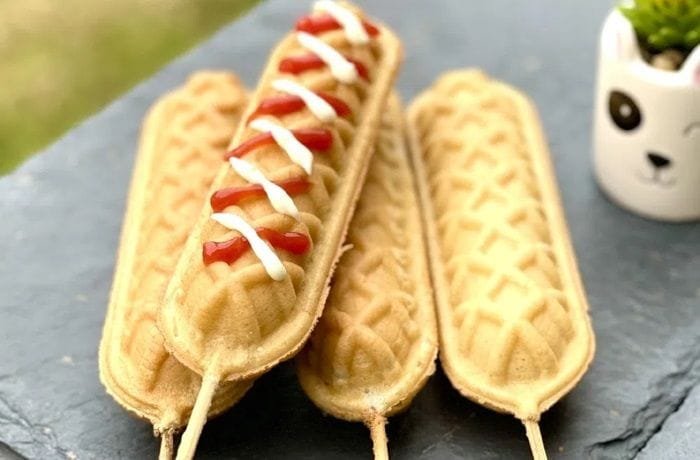 Homemade yoguis or waffle dogs on sticks served with ketchup and mustard