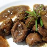 Traditional kidneys in sherry sauce with beef broth, served with parsley