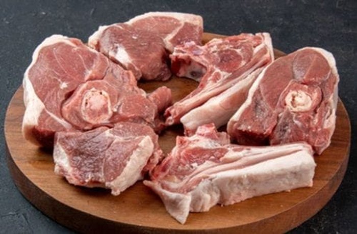 Lean alpaca meat cut into cubes, ready to marinate
