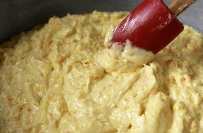 Finished orange sponge cake batter baked evenly in its mold