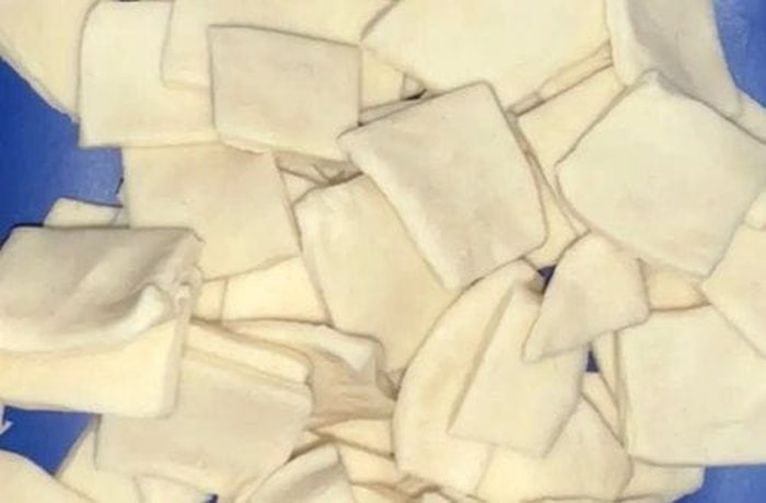 Flour and water dough rolled and cut into small squares for pancutras