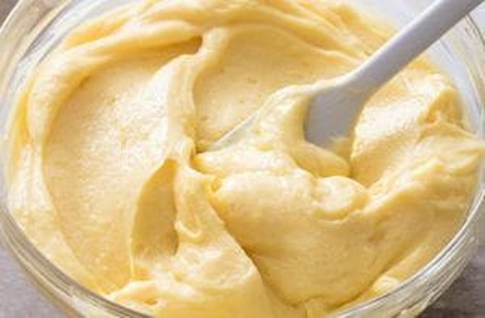 Bright yellow, smooth pastry cream made with vanilla and egg yolks, ready for filling