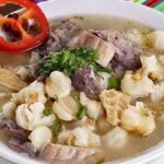 Peruvian caldo de mote, a hearty hominy and mutton soup with potatoes