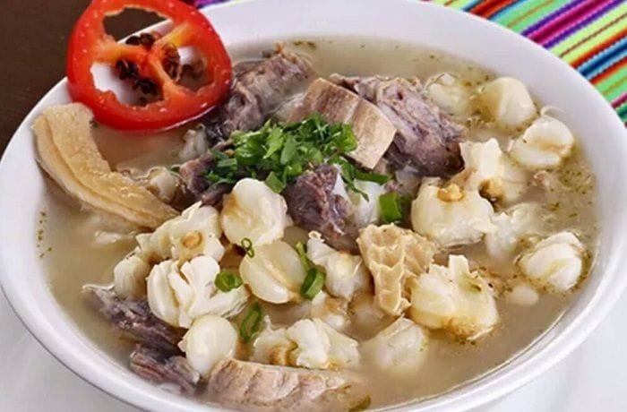 Peruvian caldo de mote, a hearty hominy and mutton soup with potatoes