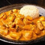 Peruvian picante de mariscos, a creamy spicy seafood stew with octopus, shrimp, and squid