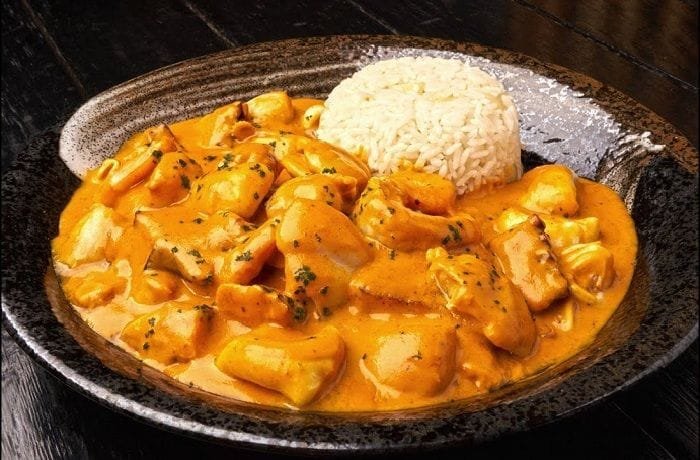 Peruvian picante de mariscos, a creamy spicy seafood stew with octopus, shrimp, and squid