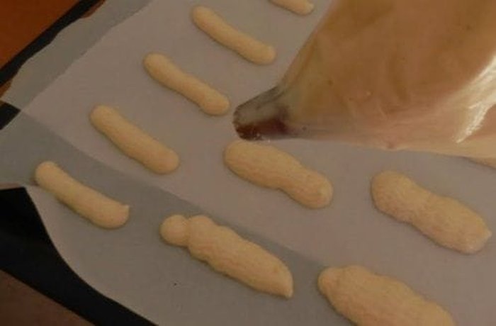 Piping bag with a plain round tip for shaping long ladyfinger biscuits