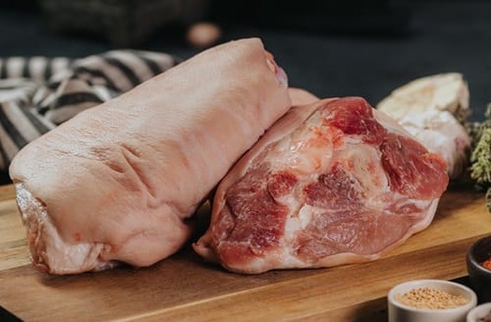 Raw pork leg ready to inject and marinate for pernil
