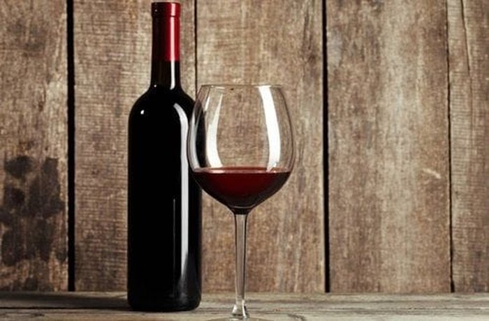 A bottle of Cabernet Sauvignon red wine, used as the braising liquid for slow cooking the tapapecho.
