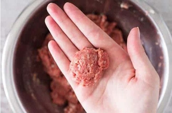Shaping the beef meatballs by hand