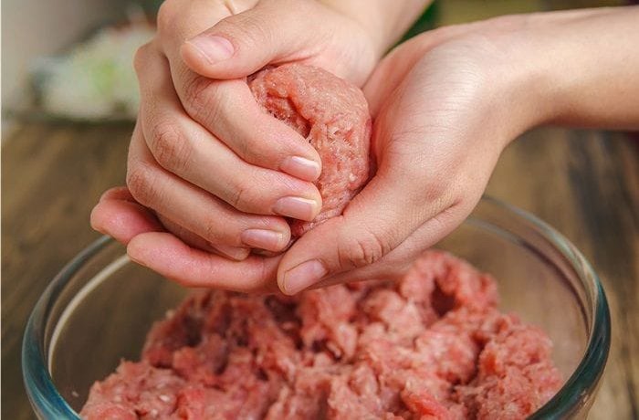 Shaping homemade burger patties by hand