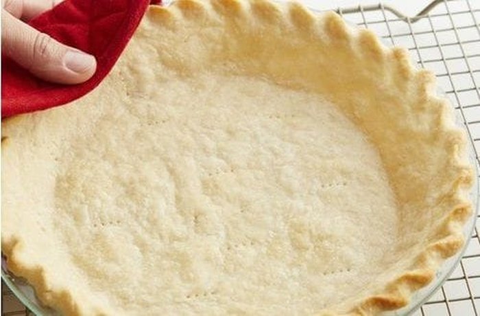 Tart dough rolled out and placed in a tart pan