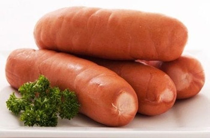 Thick gorda sausages boiled in a pot with oregano and garlic