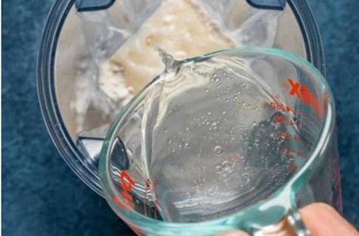Adding boiling water to sugar and butter for condensed milk