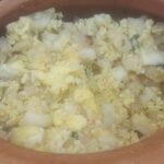 Andean chuño with eggs and fresh cheese, sprinkled with parsley