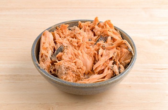 Canned salmon drained and flaked for Chilean empanadas