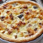 Chicken and vegetable quiche with a golden cheese topping