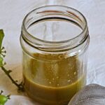 Chilean agraz, the sour juice of unripe green grapes, in a glass bottle