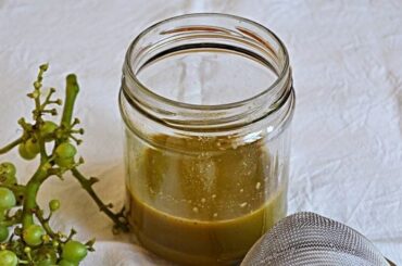 Chilean agraz, the sour juice of unripe green grapes, in a glass bottle