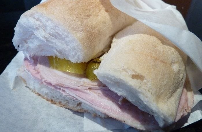 Chilean arrollado de malaya sandwich with tomato and lettuce