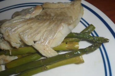 Chilean baked fish with potatoes and vegetables in a baking dish