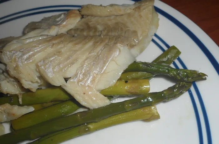 Chilean baked fish with potatoes and vegetables in a baking dish