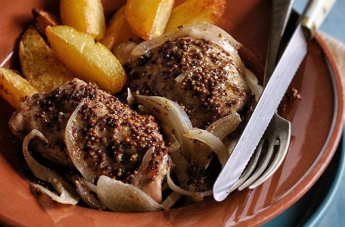 Oven baked mustard chicken with potatoes and onion