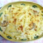 Chilean tallarines bontú, baked pasta with ham, mushrooms and golden cheese, homemade recipe