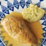 Chilean braised chicken, pollo al jugo, with onion and bay leaf in its juices