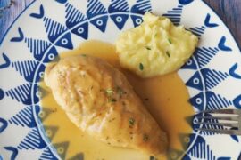 Chilean braised chicken, pollo al jugo, with onion and bay leaf in its juices