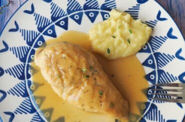 Chilean braised chicken, pollo al jugo, with onion and bay leaf in its juices