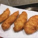 Golden breaded chicken tenders, Chilean filetitos de pollo apanado, ready to serve