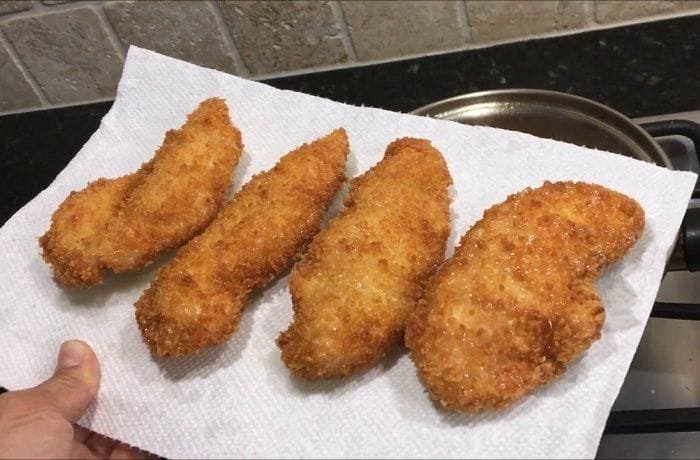 Golden breaded chicken tenders, Chilean filetitos de pollo apanado, ready to serve