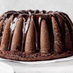 Moist Chilean chocolate loaf cake, queque de chocolate, sliced and dusted with powdered sugar
