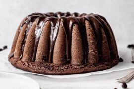 Moist Chilean chocolate loaf cake, queque de chocolate, sliced and dusted with powdered sugar