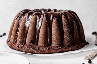Moist Chilean chocolate loaf cake, queque de chocolate, sliced and dusted with powdered sugar