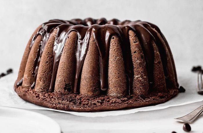 Moist Chilean chocolate loaf cake, queque de chocolate, sliced and dusted with powdered sugar