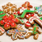 Chilean Christmas cookies cut into festive shapes and decorated with colored icing and sprinkles