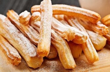 Homemade Chilean churros, crisp and golden, some dipped in chocolate